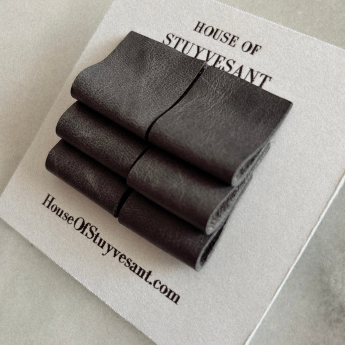 new! "gray, never fold" leather earrings